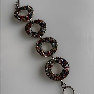 Doughnut hole beaded bracelet/ silver tone/ measures 7.5 in length
